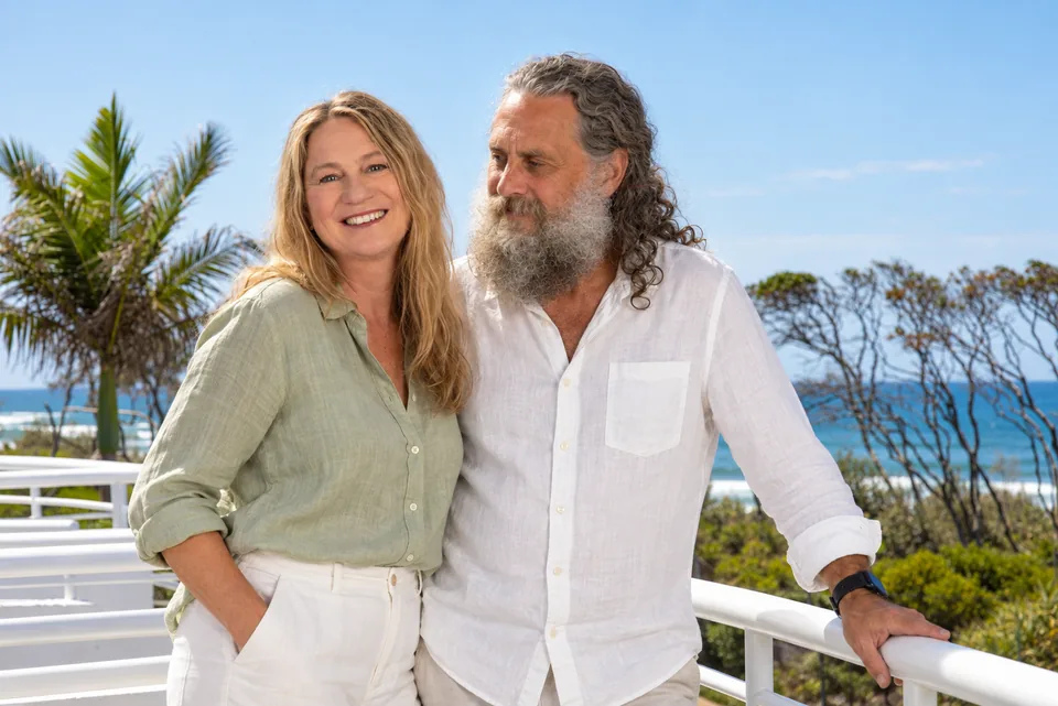 Deb Pepperdine and Ian Trew on a balcony by the sea