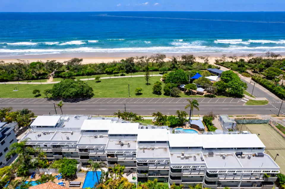 The resort, the beachside park and the coast from the air