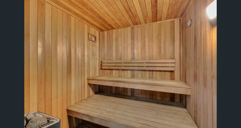 Timber benches inside the shared sauna